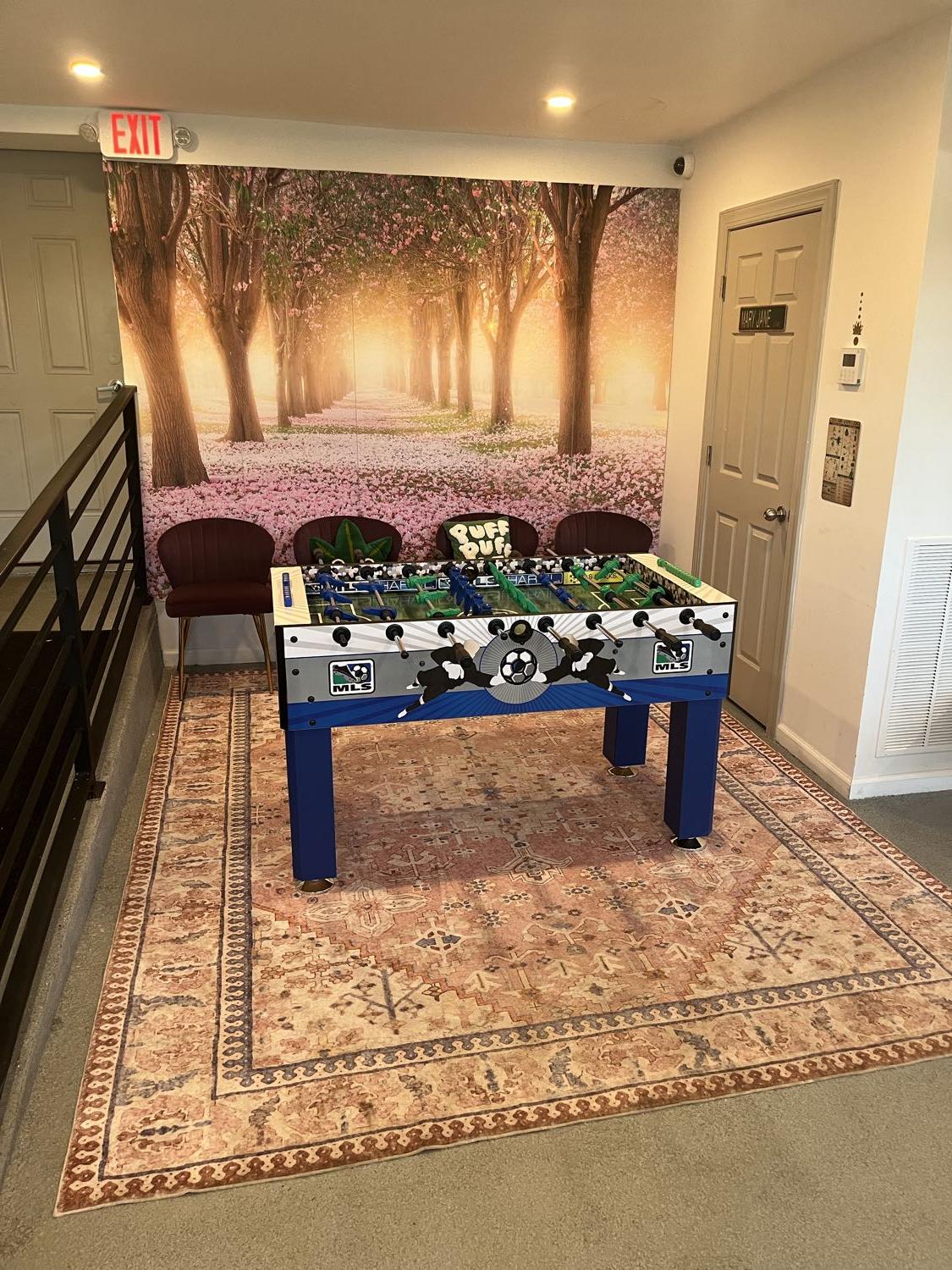 Cherry blossom mural wall and lounge seating inside the ANJA dispensary
