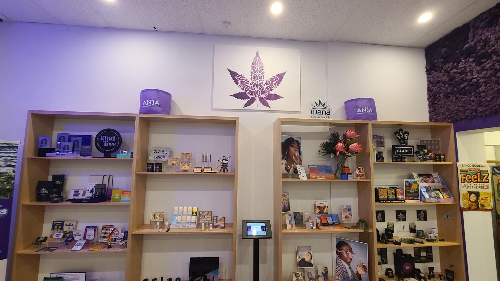Cannabis products on blond-wood display shelves at ANJA in Highland Park