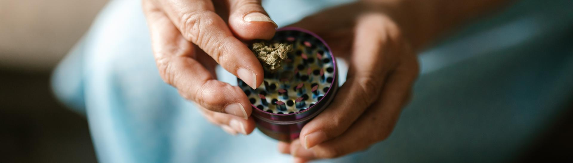 older woman grinding weed